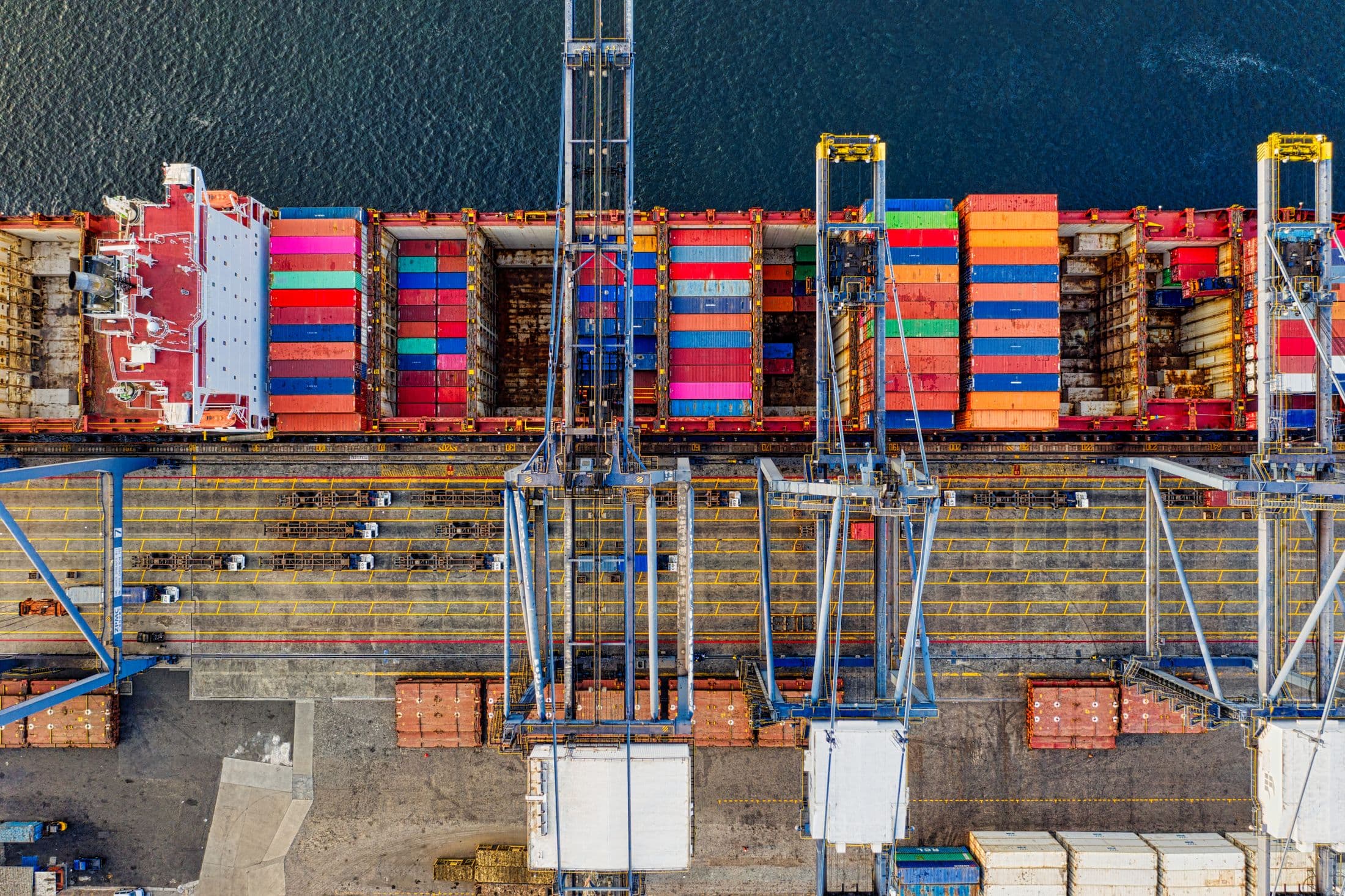 Cargo vessel moving through an international container port